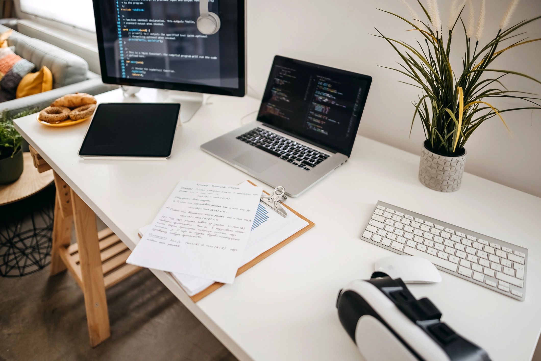 Desk workspace with monitor and laptop
